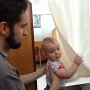 Daniel playing with the curtain for our private table.