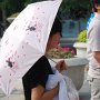 Many women carry umbrellas even when it doesn't rain.  These fancier umbrellas serve to keep the sun off their skin.