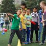 Teaching the kids how to throw a Frisbee.