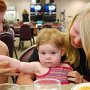 Playing with someone else's baby is a favorite pasttime, and gives the moms some time to eat their dinner. :)