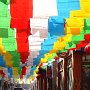 A view down a street of Da Zhao, a big temple area in Hohhot. The colorful flags are Tibetan Buddhist prayer flags.