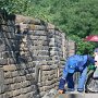 A Chinese man works to keep the Great Wall clean.