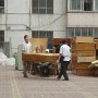 Movers emptying out the international student dormitories behind our apartments.