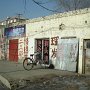 A couple of older run-down shops near the campus.