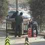 Workers prepare to set off a bunch of firecrackers in front of the hotel we live in.