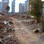 A demolished village will eventually mirror the highrise apartments in the background. Out with the old and in with the new occurs often in China.