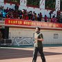 Teachers, both participants and spectators, fill the bleachers for Sports Day.