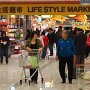 Shoppers leave the Life Style Market, a major supermarket inside a mall.