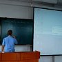 We are shown how to use the media consoles in one of the classrooms.