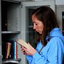 Deb, a teacher at Gong Da (another university in Hohhot), reads from our office library.