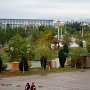 The campus on a chilly fall day.  Snow can be seen on the mountains in the distance.