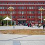 Students stream out from another teaching building to head to their next class.