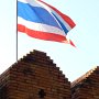 Thailand's flag flies over the Tha Phae gate, a remaining section of the old wall.