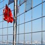 A Chinese flag whips in the wind at the observation deck.